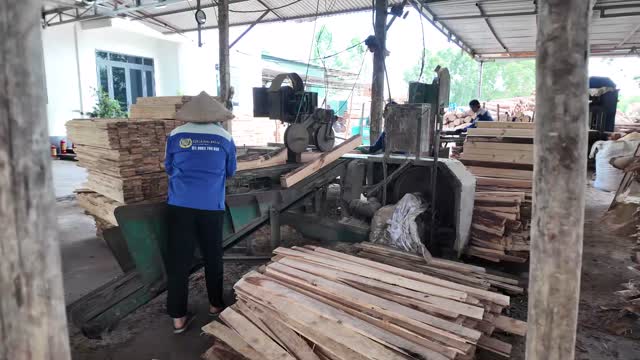 Feeding Planks Into Wood Machine