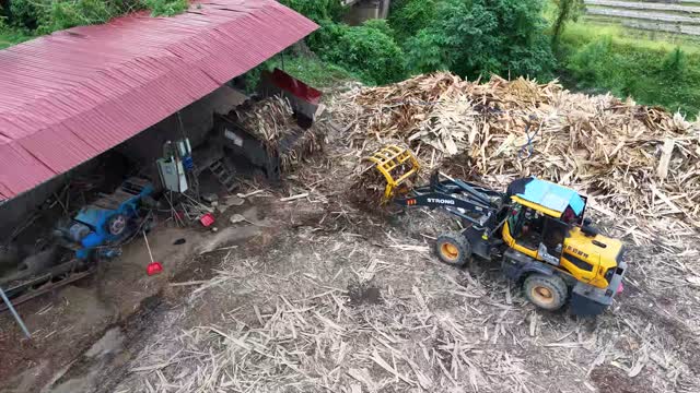 Loader Pushing Wood Chips