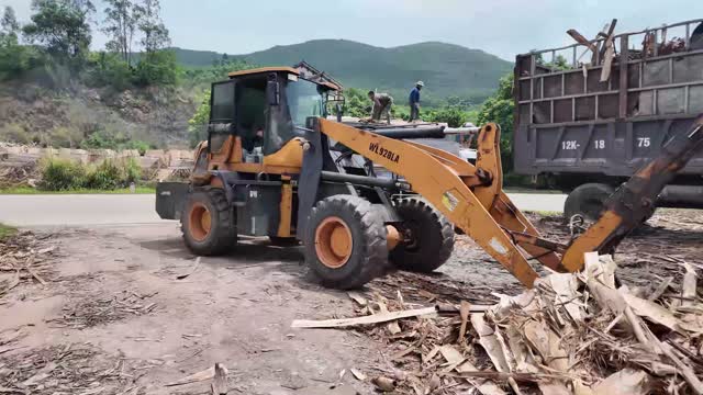 Loader And Truck By Road
