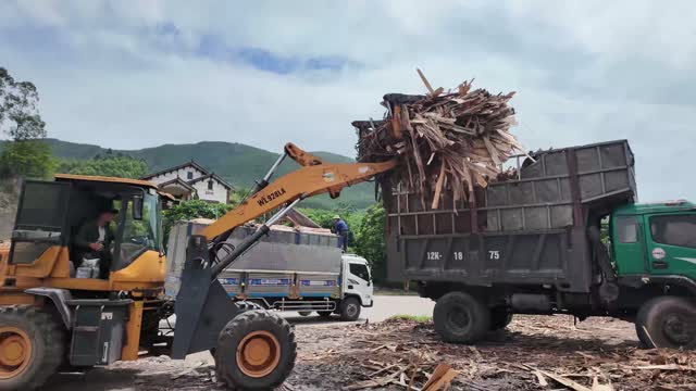 Dumping Wood Scrap Into Truck