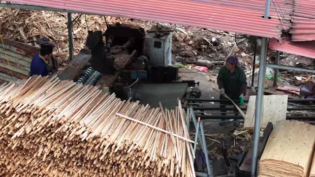 Workers At Dowel Machine