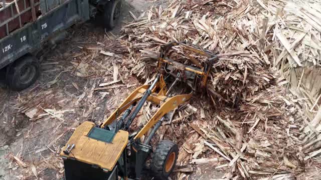Aerial Loader In Wood Scrap