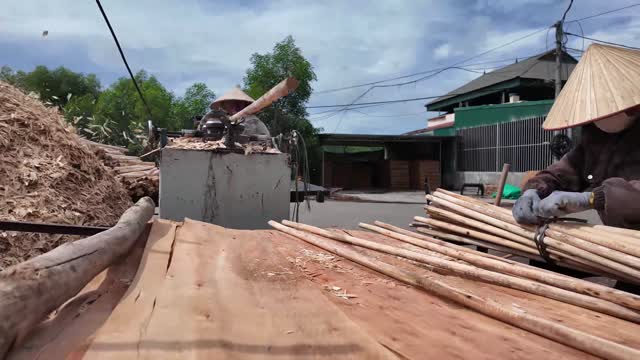 Feeding Wood Into Rounding Machine