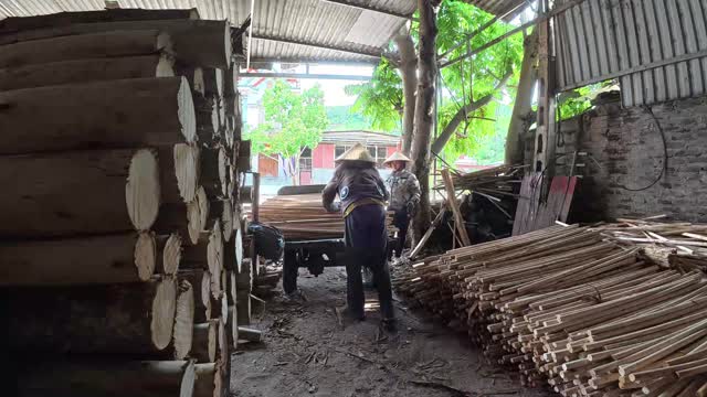 Workers Loading Timber Cart