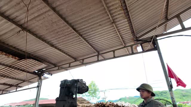 Machine And Worker Under Shed