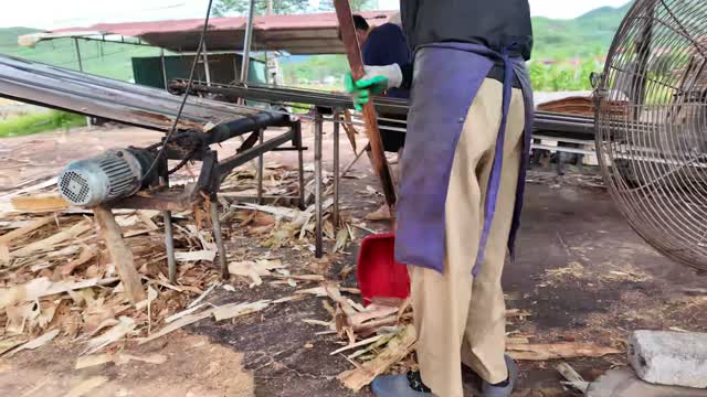Worker Clearing Wood Debris