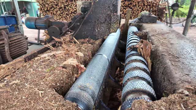 Close-Up Of Wood Peeling Rollers