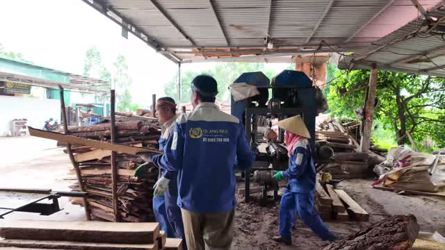 Workers At Timber Press Machine