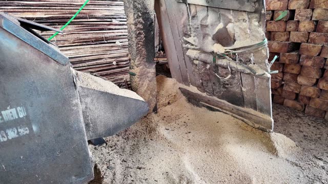 Sawdust Pouring From Chute
