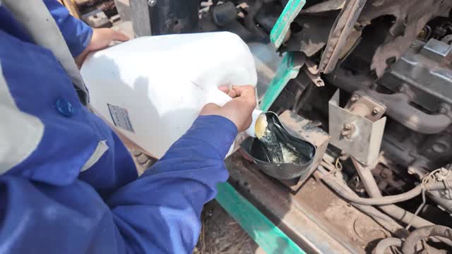 Filling Forklift With Oil