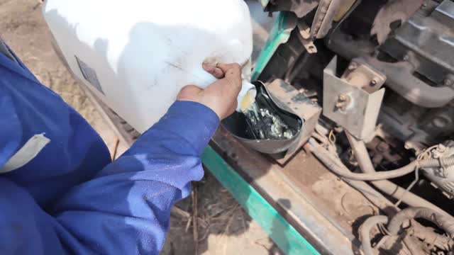 Hands Adding Engine Oil