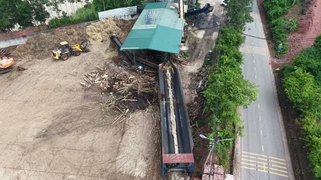 Bark Feeding Into Processing Machine