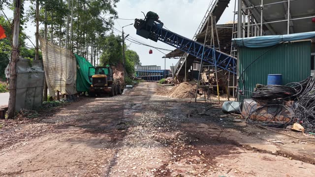 Worker Clearing Conveyor Belt