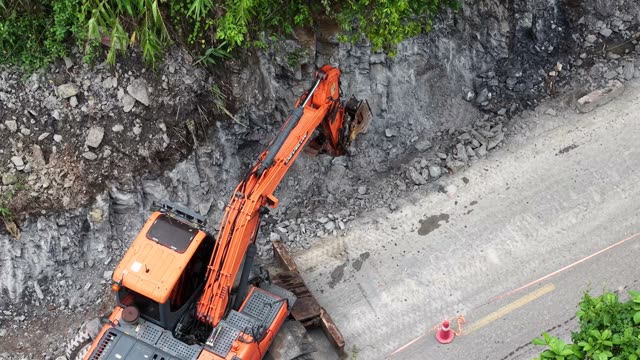 Excavator Digging Rock Slope