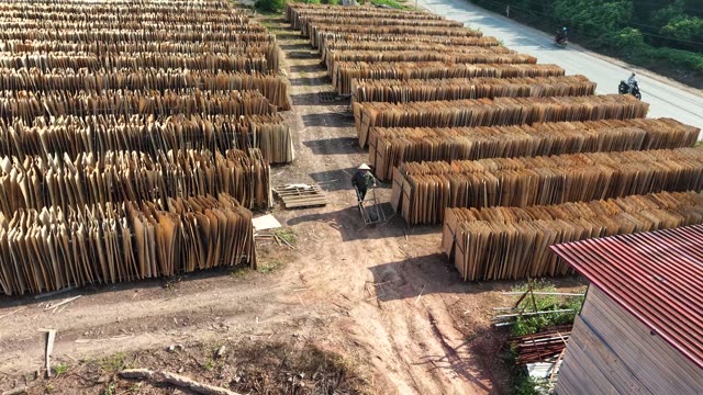 Worker Pushing Cart In Bark Yard