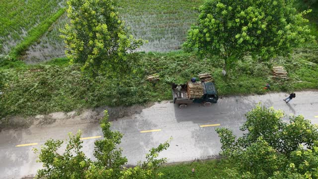 Aerial Village Road And Paddies