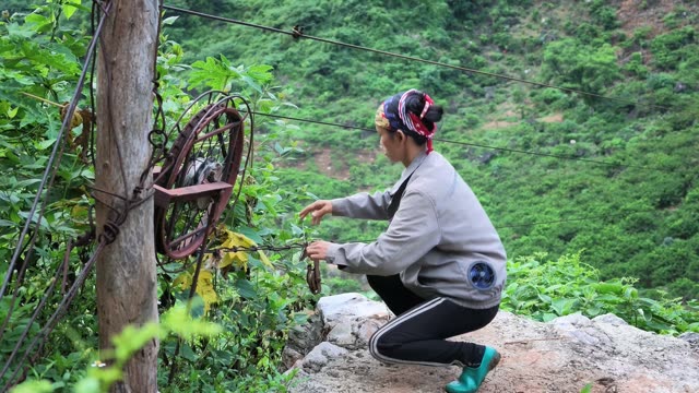 Woman Working Near Pulley Wheel