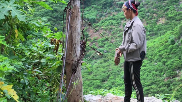 Woman Handling Rope At Cable Post