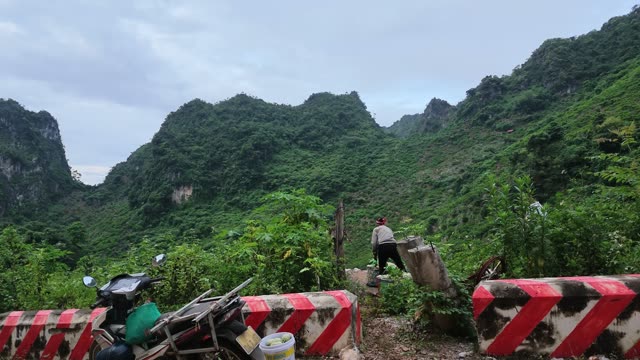 Man Walking By Roadside Barriers