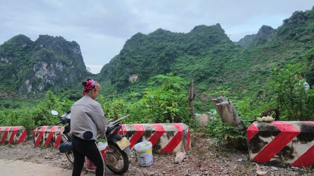 Woman Loading Fruit Onto Motorbike