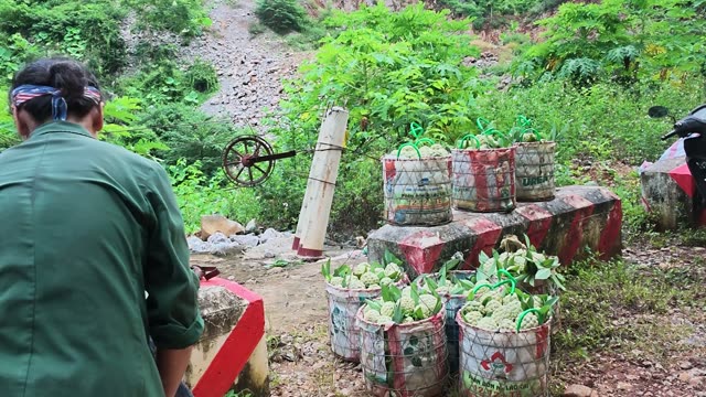 Man Walking Past Roadside Fruit Baskets