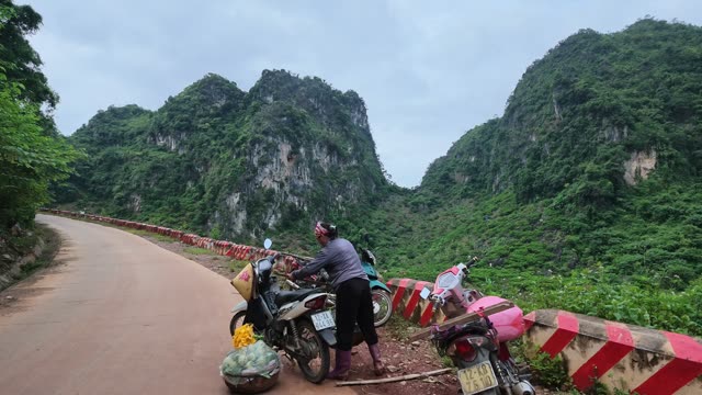 Woman Packing Motorbike Basket On Road