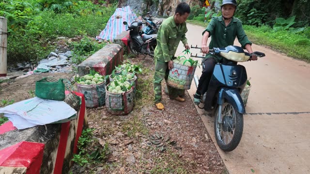 Man Carrying Basket Toward Motorbike