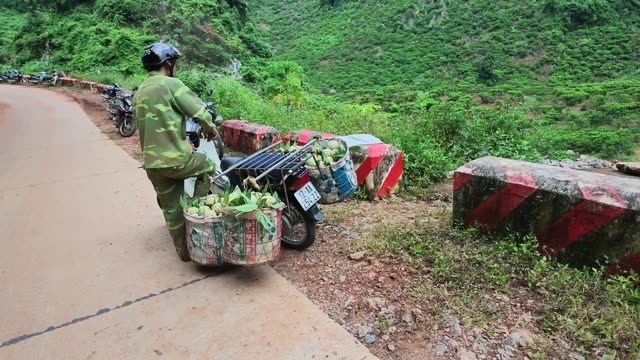 Man Riding Away With Loaded Motorbike