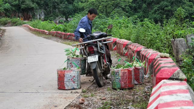 Man Riding Motorbike With Baskets