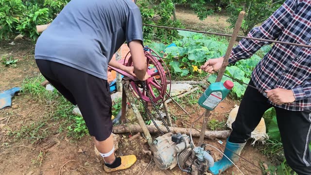 Man And Woman Fixing Water Pump