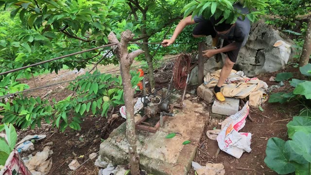Man Fixing Old Pump Machine