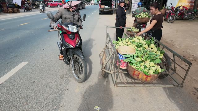 Man And Woman With Produce Cart