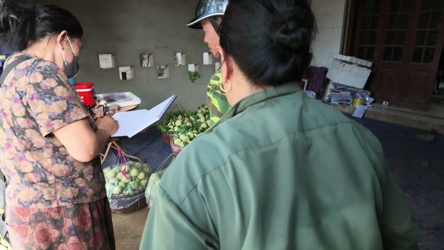 Man Arranging Basket By Wall