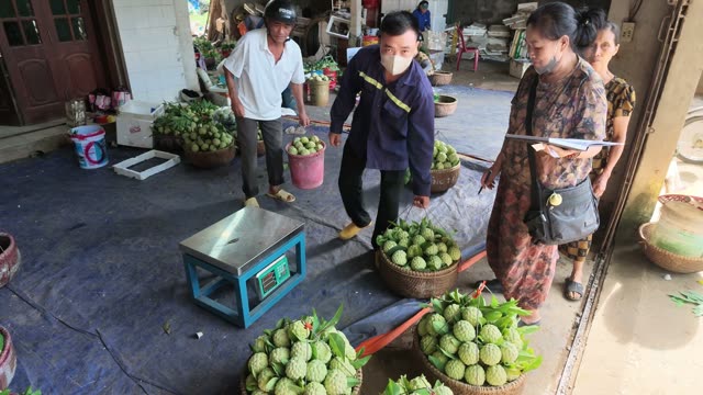 Men Carrying Bucket To Scale