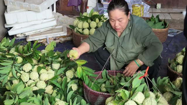 Woman Reaching For Fresh Fruit