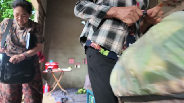 Man Adjusting Apron By Sack