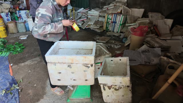 Man And Woman Packing Baskets Together