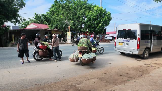 Motorbike Crossing Busy Street