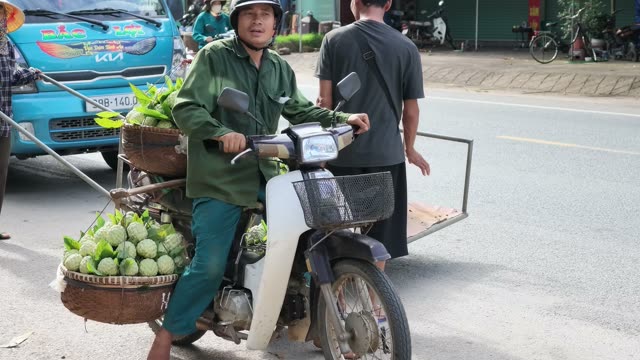 Man Riding Loaded Motorbike