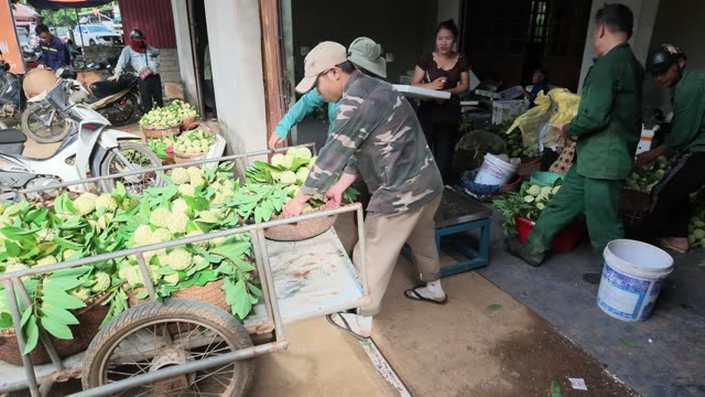 Man Pushing Cart With Baskets