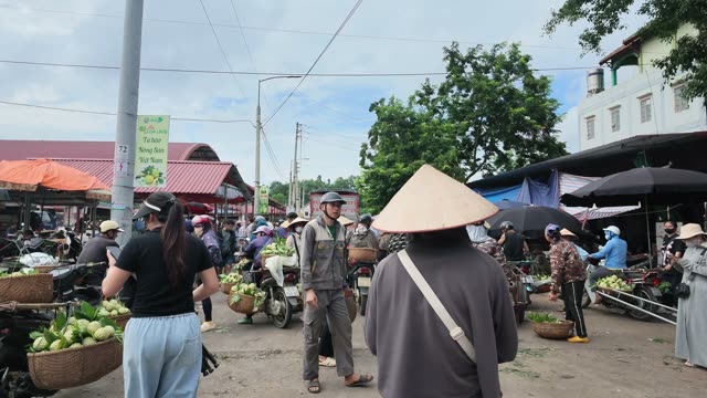 People At Market Stall