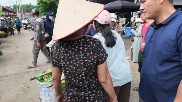 Man Carrying Barrel By Cart