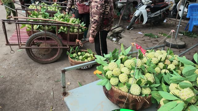 Man Riding Motorbike With Fruit Basket
