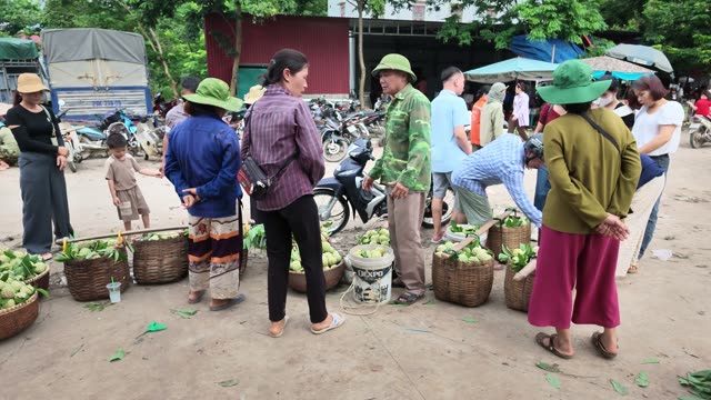 People Gathered With Fruit Baskets