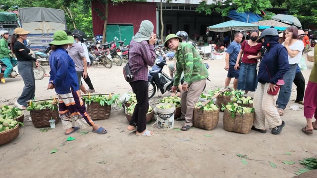 Man And Woman At Roadside Market