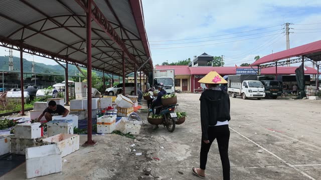 Women Standing By Sorting Boxes