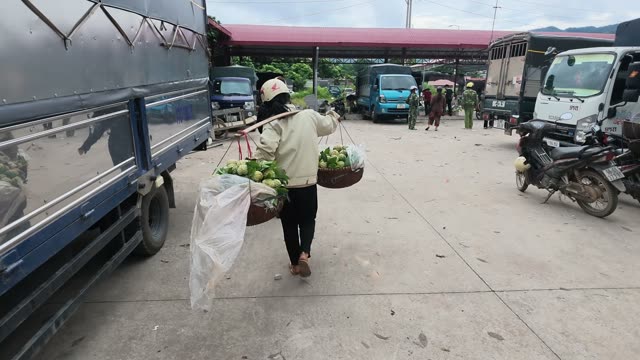 Woman Riding Motorbike With Baskets