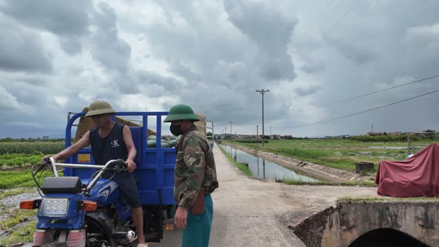 Farmer On Three Wheeled Cart
