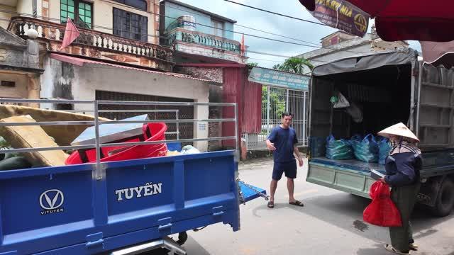 Loading Produce Between Trucks