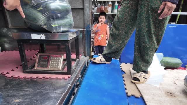 Weighing Produce With Child